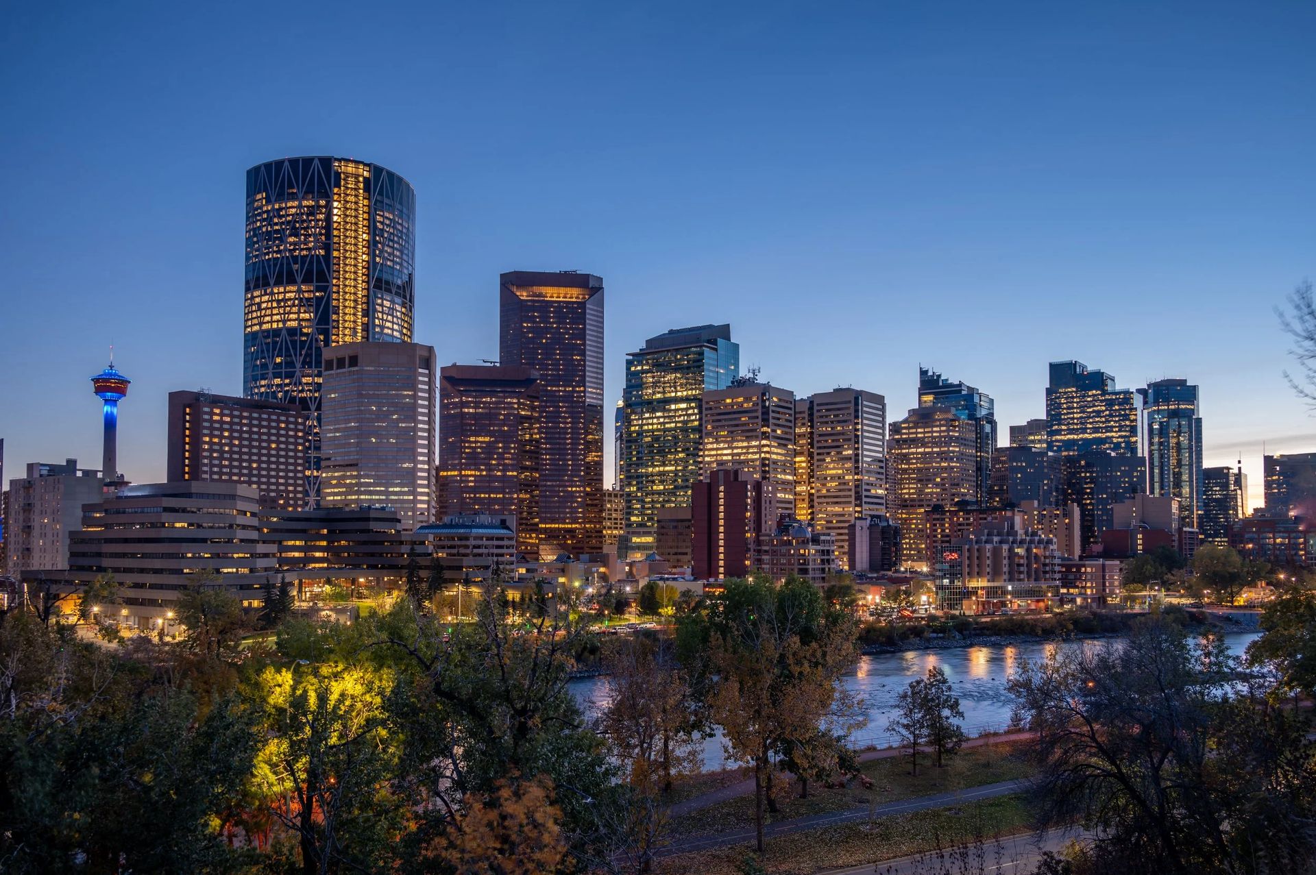 Downtown Calgary skyline at dusk along the Bow River