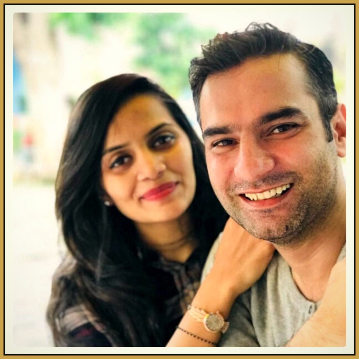 Bijal and Gautam Goglani, co-founders of Z Luxury Rental Services, smiling together outdoors